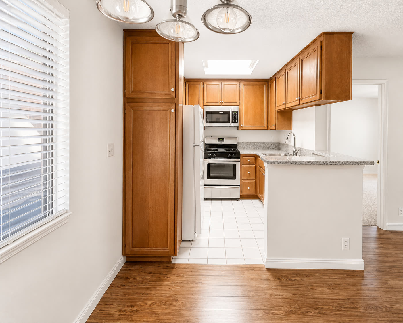 Kitchen with granite counters and gas range